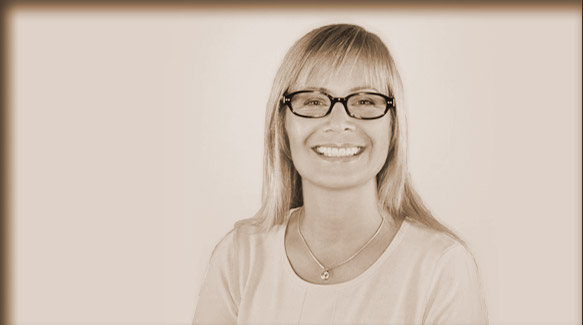 woman with glasses smiling